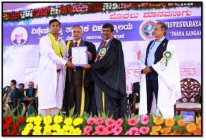 Prof. L. V. Malade receiving Ph. D degree in Chemical Engineering through hands of            Hon. Dr. Karisiddappa, Vice Chancellor VTU Belagavi.